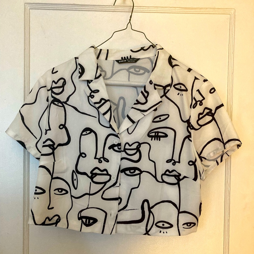 Cropped white Shein shirt with navy graphics